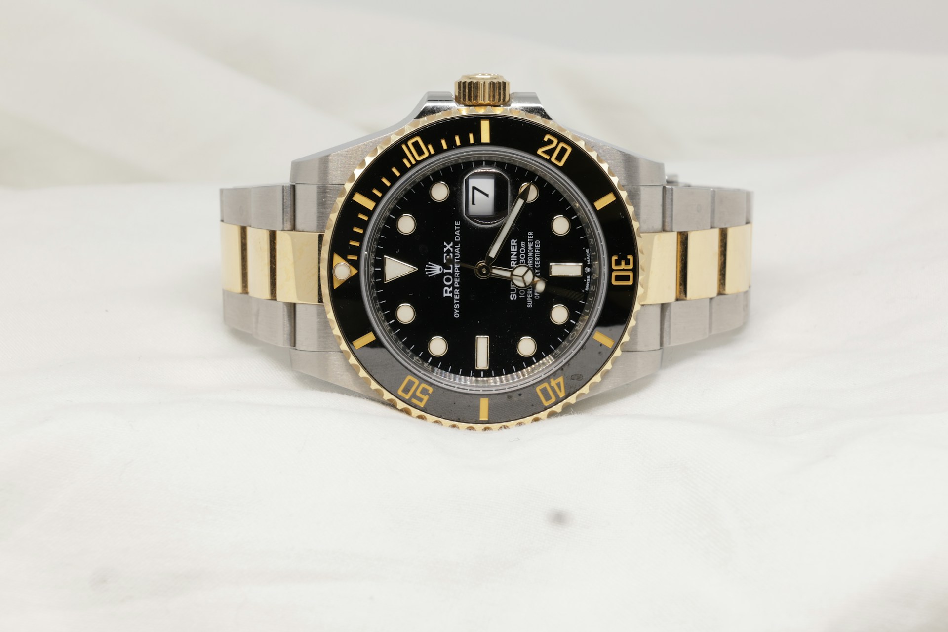 Two-tone Rolex Submariner on white background