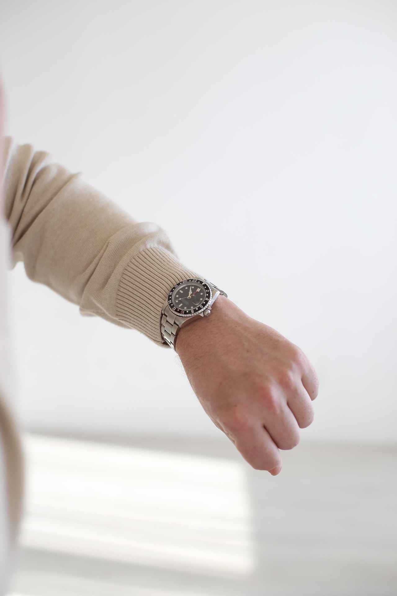 Person wearing Rolex watch